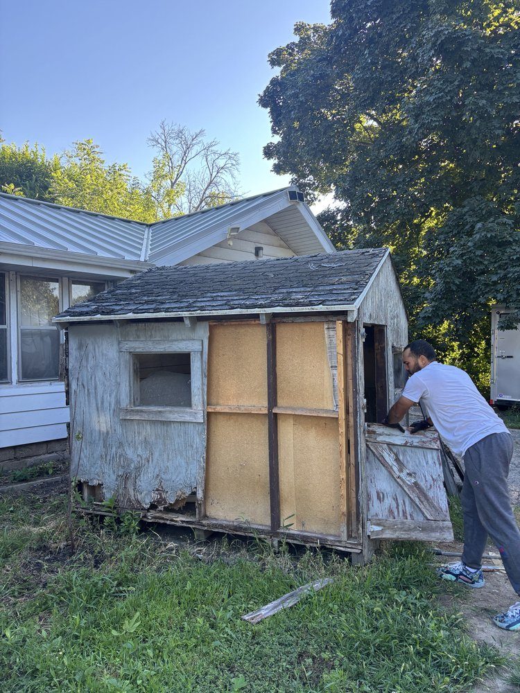 Old backyard shed being torn down and cleared